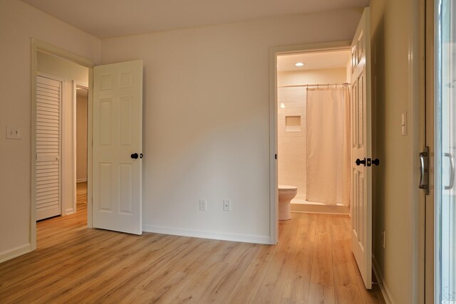 spare room featuring light hardwood / wood-style flooring and ceiling fan