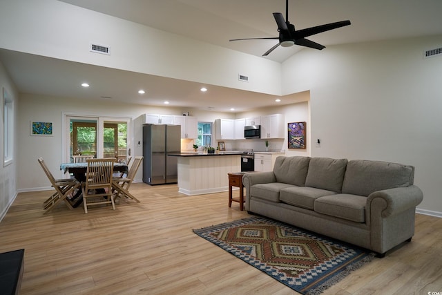 spare room with ceiling fan and light wood-type flooring