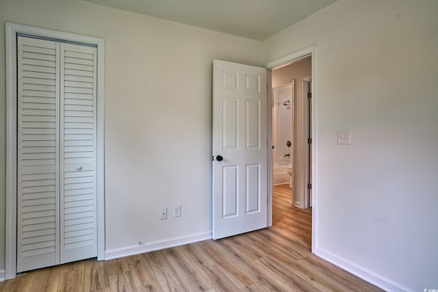 spare room with hardwood / wood-style flooring and ceiling fan