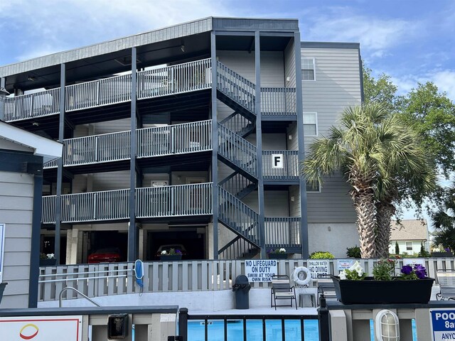 view of building exterior with a community pool