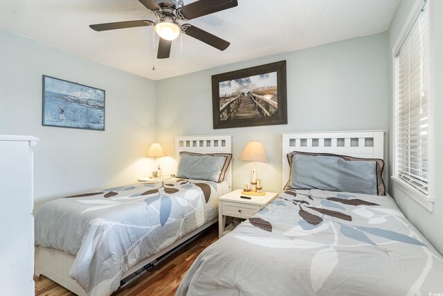 bedroom featuring wood-type flooring and ceiling fan