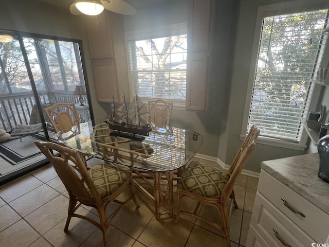 dining area featuring light tile patterned flooring and plenty of natural light