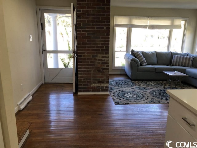 living room with dark hardwood / wood-style flooring and a baseboard radiator