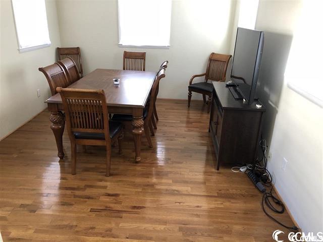 dining room with hardwood / wood-style flooring