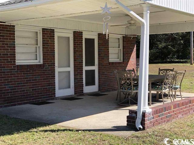 view of patio / terrace featuring ceiling fan