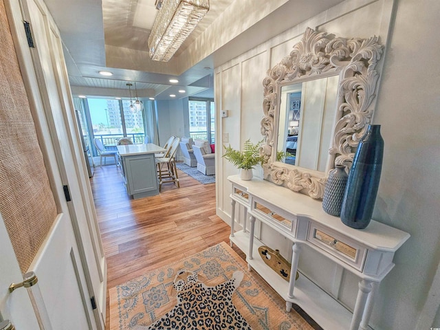 hallway with light wood-style floors and recessed lighting