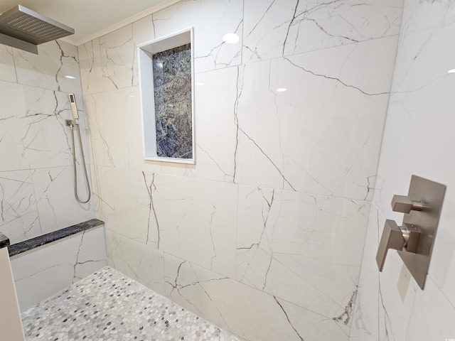 bathroom with a marble finish shower