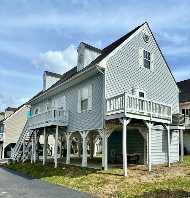 back of property with a wooden deck