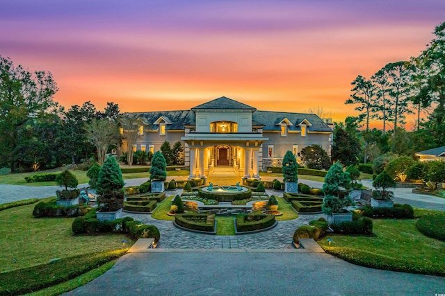 9400 Lake Dr, Myrtle Beach, SC 29572 - view of front of house with stucco siding and a front lawn