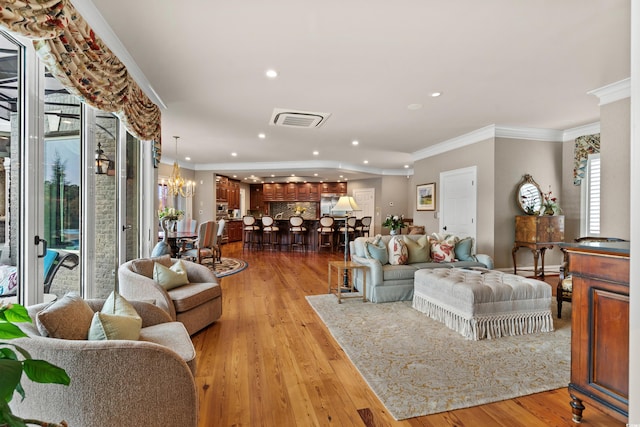 9400 Lake Dr, Myrtle Beach, SC 29572 - living room with light wood-style flooring, ornamental molding, and visible vents