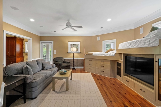9400 Lake Dr, Myrtle Beach, SC 29572 - living room featuring a ceiling fan, crown molding, a healthy amount of sunlight, and wood finished floors
