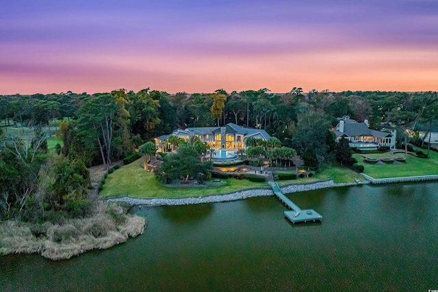 9400 Lake Dr, Myrtle Beach, SC 29572 - aerial view at dusk featuring a wooded view and a water view