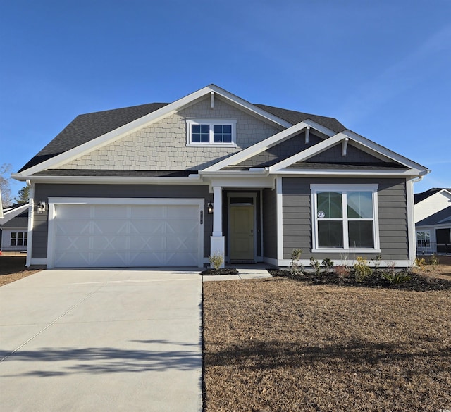 view of front of property with a garage