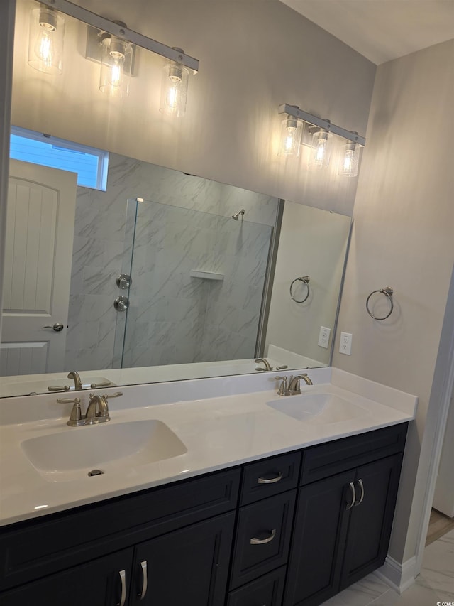 bathroom featuring a shower and vanity