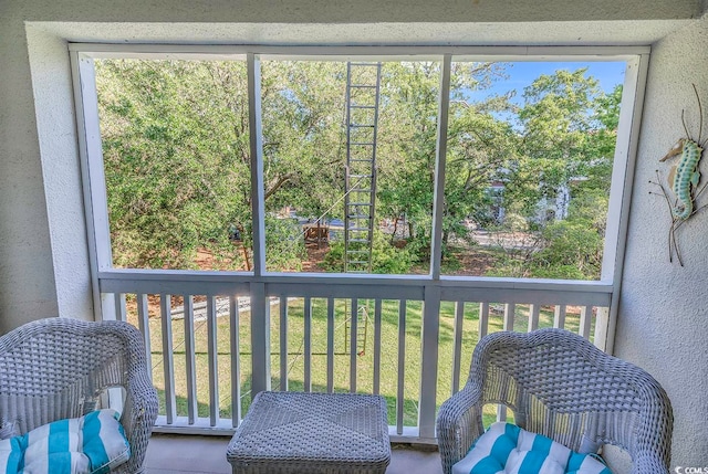 sunroom featuring a wealth of natural light