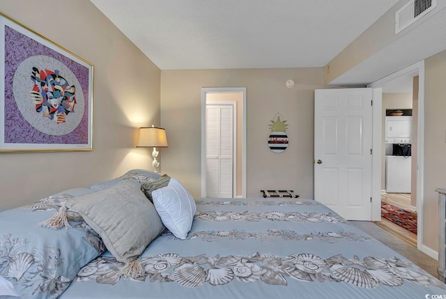 carpeted bedroom with a closet