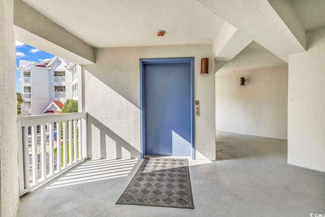 entrance to property with a balcony