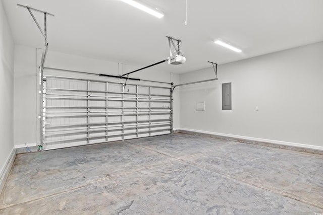 garage featuring baseboards, a garage door opener, and electric panel