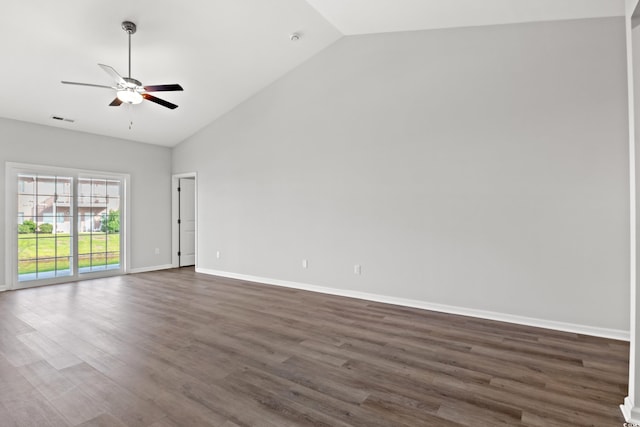 spare room with dark hardwood / wood-style flooring, high vaulted ceiling, and ceiling fan