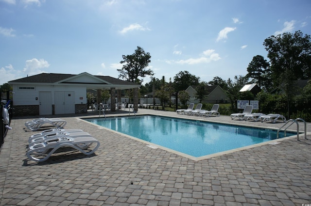 view of swimming pool with a patio