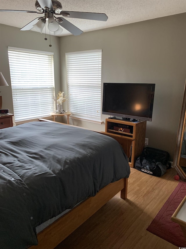 2276 Essex Dr Unit A, Myrtle Beach, SC 29575 - bedroom featuring wood finished floors, ceiling fan, and a textured ceiling