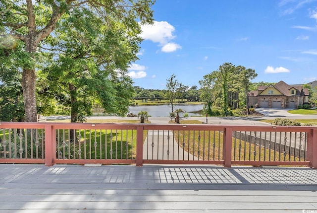 wooden deck featuring a garage