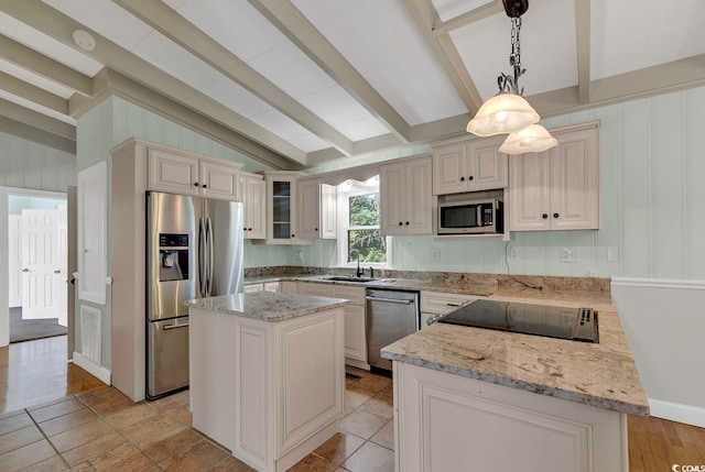 kitchen with a center island, hanging light fixtures, vaulted ceiling with beams, stainless steel appliances, and sink