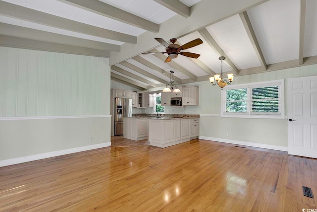 unfurnished living room with vaulted ceiling with beams, light hardwood / wood-style flooring, and ceiling fan with notable chandelier