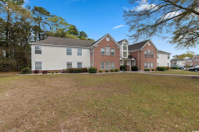 traditional-style home with a front yard