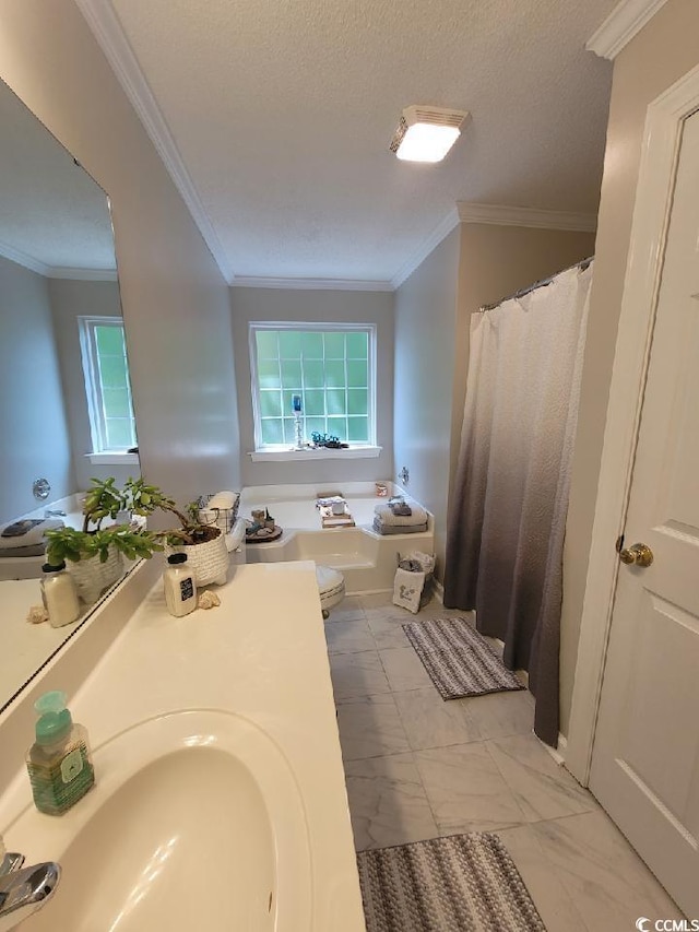 bathroom featuring marble finish floor, crown molding, and vanity