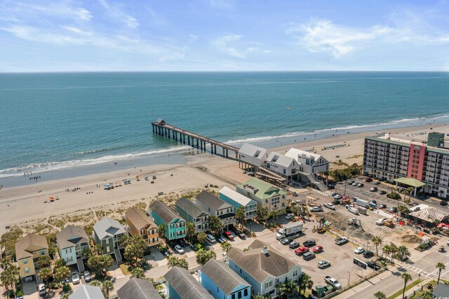 birds eye view of property featuring a view of the beach and a water view