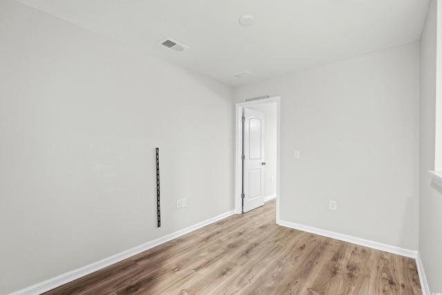 empty room with light hardwood / wood-style floors