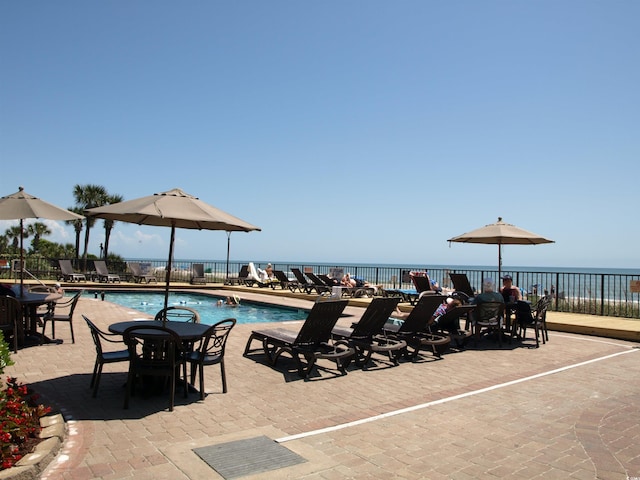 view of swimming pool featuring a patio area