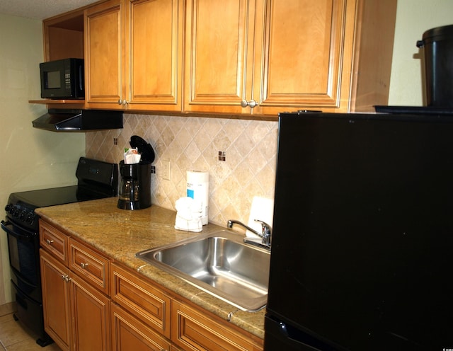 kitchen featuring fume extractor, backsplash, light tile flooring, black appliances, and sink