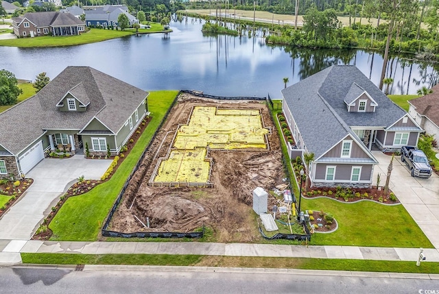 bird's eye view with a water view