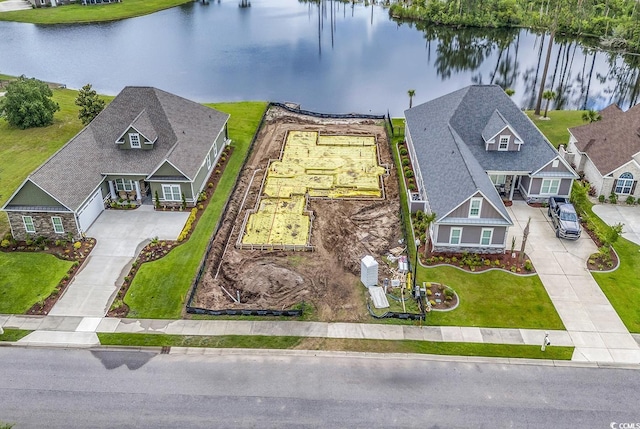 bird's eye view with a water view