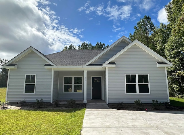 view of front of property with a front lawn and covered porch