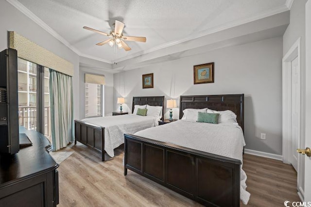 bedroom with ceiling fan, access to exterior, wood-type flooring, a textured ceiling, and ornamental molding