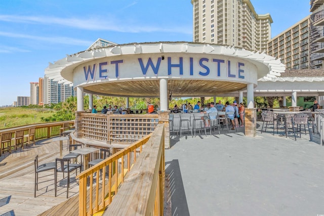 view of patio / terrace with a deck and an outdoor bar