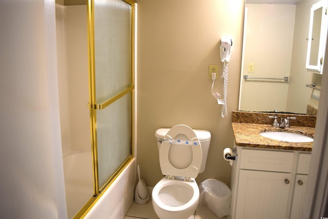 full bathroom featuring shower / bath combination with glass door, vanity, and toilet