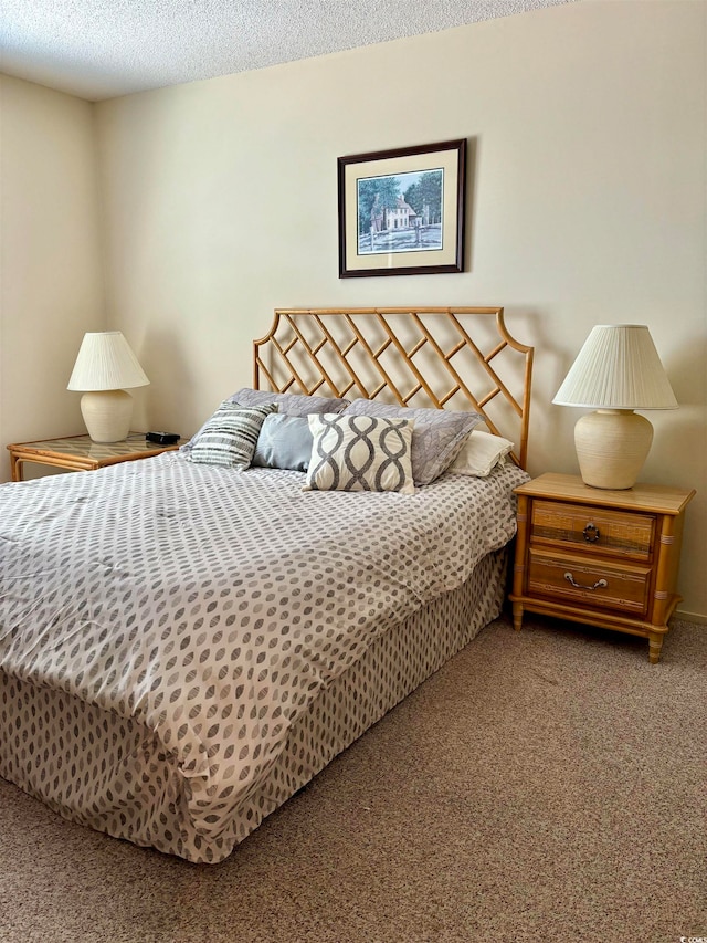 carpeted bedroom featuring a textured ceiling