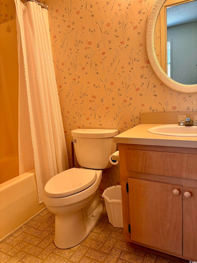 full bathroom with vanity, toilet, and shower / bath combo with shower curtain