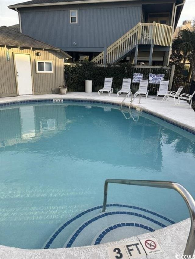 view of swimming pool featuring a patio