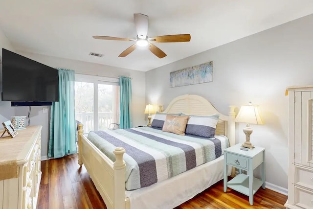 bedroom with ceiling fan and dark hardwood / wood-style floors