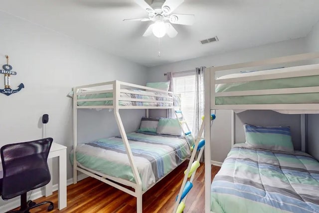 bedroom with ceiling fan and hardwood / wood-style flooring