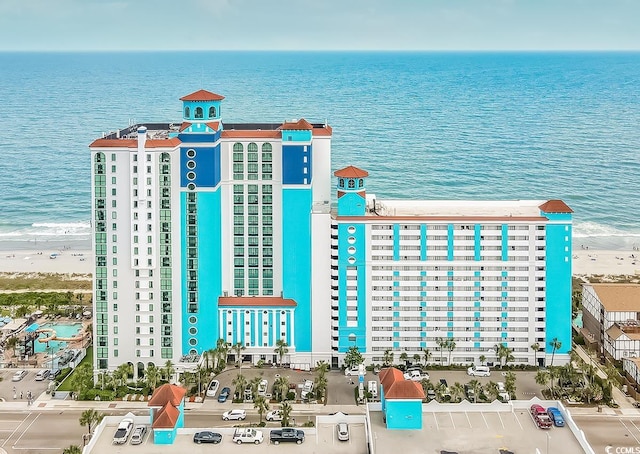 bird's eye view with a beach view and a water view