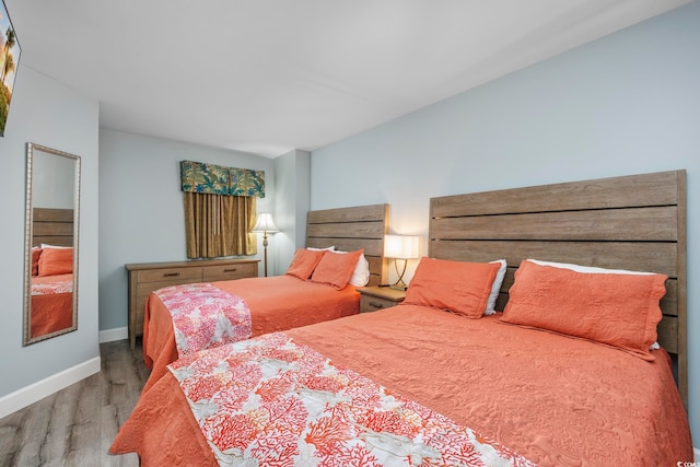 bedroom with hardwood / wood-style floors