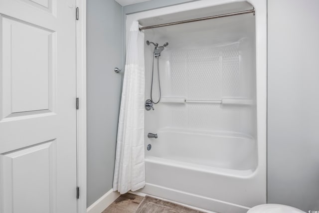 bathroom featuring shower / tub combo with curtain