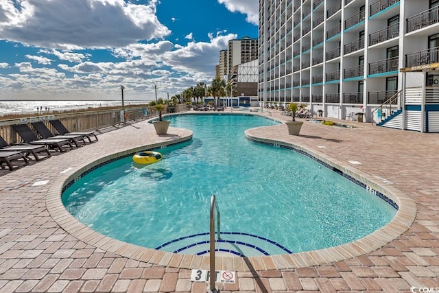 view of pool featuring a patio area