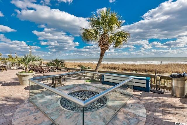 view of terrace featuring a water view